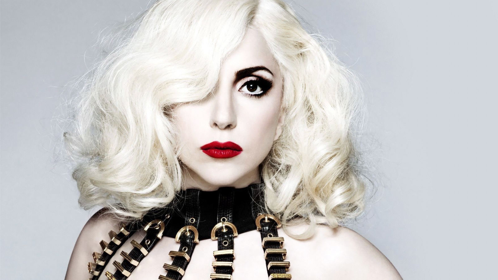 Lady Gaga with platinum curls and red lips